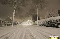 Besneeuwde straat op 11-12-2017.