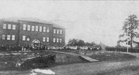 Old E.K. Powe school on Ninth Street (where 1966 cafeteria building stands today). West Durham Graded School was built in 1912-13. Note that Ninth Street is a dirt road with a drainage ditch. 1913 article in the Herald expressed dismay about all the drainage ditches and mosquitoes in West Durham.