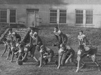 E.K. Powe football team. In 1946, '47 and '48, the E.K. Powe Green Dragons won three national age-group football championships. Front line (left to right): Fred Anders, Jimmy Pulley, Charles Dukes, Commie Rigsbee, Sumter Brawley, Craig Moon and Bill Simpson. Backfield (left to right): Bobbie Burns, Paul Reeves, Ralph Dennis and Charles Andrews (1948). In the old days, girls only played in the upper field (by West Knox) and boys only played in the lower field (by Green Street). In 1958, the students demanded to play together and the boy-girl separation was removed.