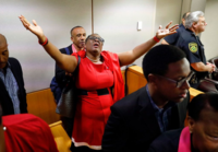 Jean's mother, Allison Jean, rejoices after hearing the verdict on Tuesday for her son's murder. Photo originally from Dallas Morning News