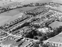 Mulbarton First & Middle School from the air, 1975 (very white roofs show up among the trees of the Common and Mulbarton Hall)