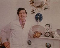 Maurice at home with just a few of the caps, medals, plates, etc he won in his distinguished football career.