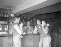US Airmen inside World’s End bar, with landlord, Mr. W. H. (Billy) Swift – dated Oct. 1943