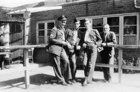 US Airmen in uniform outside back of World’s End, with Mr. W. H. (Billy) Swift (Landlord) on right. Oct. 1943