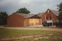 Part-built new Chemist shop next to dental surgery, July 1993. Work stopped due to protests about new commercial premises on Common land