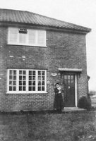 Nurse Sexton by the door of her house in Long Lane