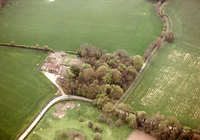 Kenningham: farmworkers' cottages; site of church in woodland; grounds of Hall in foreground