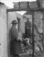 Could it have been saved? Mr & Mrs Carver survey the ruin of their home on Norwich Road. A spark from a traction engine set the thatch alight.