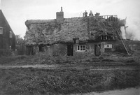Demolition of Church Cottages, 1957 or '58. One of the men on the top of the roof is Chris Mickleburgh