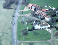 Air view, 1986, looking South. 'Carpenters' (the white house round a courtyard) is on the Common and other cottages are west of the Common boundary.