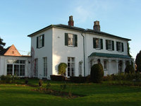 The Lodge with extension on left added by the Traffords for an indoor swimming pool. Background, left - roof of Lodge Farm barn.