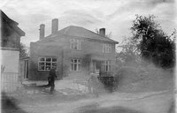 Tabor House being built for the Frost family. The old shop is still on the far left, and a single-storey shop is being added to the house.
