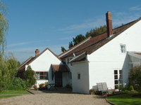 Rear of the Mill House. Low building left is former bakery. Side wall, right, was adjacent to mill