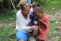 Wenche Thorkildsen with two of the many little children that have been given a new and better start in life.