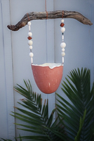 Found wood, ceramic with terra-cotta slip, and labradorite stone