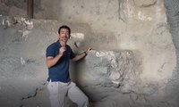 Archaeologist Amit Re’em next to the ritual bath at Gethsemane on Jerusalem’s Mount of Olives. (Yaniv Berman/ Israel Antiquities Authority)