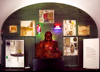 Budai, about 400 years old sculpture in gold-plated wood, surrounded by Torsten Jurell's Ban Zheng paintings