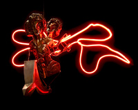 Maya, painted and patinated bronze, aluminum, neon