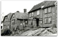 Den gamle trehusbebyggelsen i Tårngata. Foto: Statsarkivet i Stavanger.
