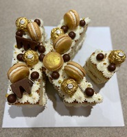 Letter K Cake with Chocolate Candy and Macarons