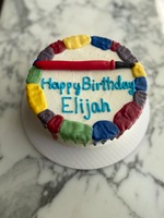 Round Strawberry Cake with Multicolored Drip and a Fondant Paint Brush Topper